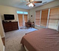 master-bedroom-shows-desk-and-tv