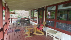 Front Wrap Around Porch with Seating and Dining Area