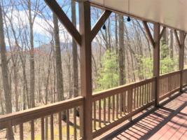 Rear Covered Deck with Wooded/Mountain View