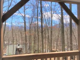 Rear Covered Deck with Wooded/Mountain View